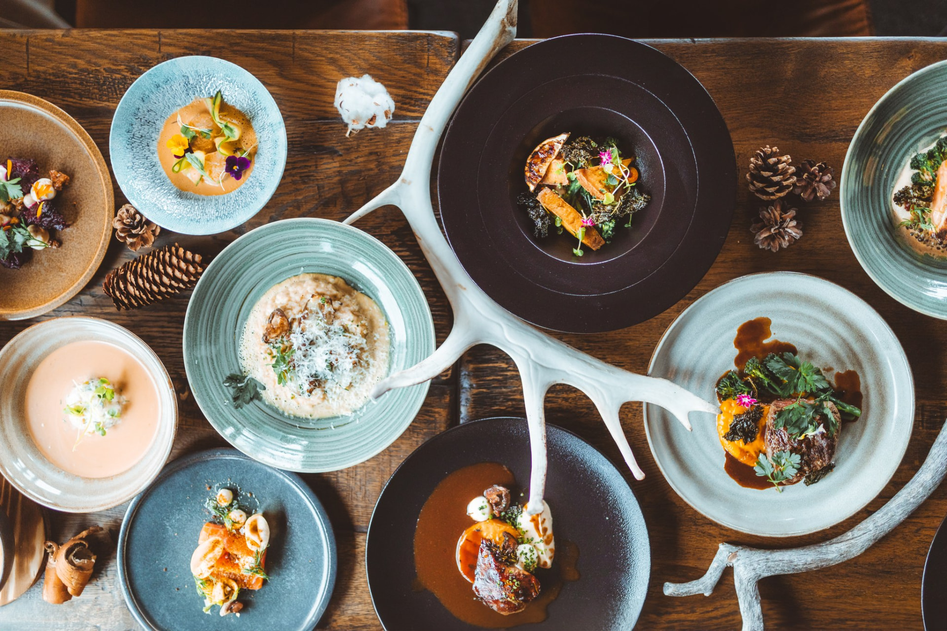 Lappish starters and main courses served on a rustic wooden table